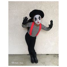 a woman dressed up as a skeleton wearing a hat