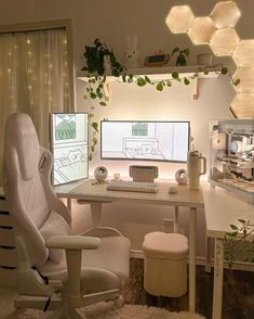 a white chair sitting in front of a computer desk