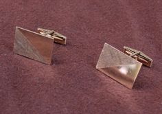 These are handsome, heavy 14K cufflinks.  They have a modernist design, with half the rectangular shape having a high shiny finish, and half with a cross-hatched  finish. Estimated age is the 1970s. Condition is good vintage. Both hinge pins work well.  Each rectangular cufflink features one-half highly polished gold and one-half textured cross hatching, as contrast. The cufflinks are each stamped 14K and VWC. DIMENSIONS  Length: 7/8 inch Width: 9/16 inch Weight: 10.5 grams  SKU 1594 Luxury Rectangular Cufflinks With Polished Finish, Gold Rectangular Cufflinks For Anniversary, Modern Rectangular Jewelry For Formal Occasions, Classic Gold Rectangular Cufflinks, Rectangular Polished Cufflinks For Formal Wear, Modernist Rectangular Jewelry For Formal Occasions, Rectangular Polished Finish Cufflinks For Anniversary, Rectangular Cufflinks For Business, Elegant Rectangular Cufflinks With Polished Finish