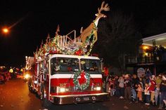 a parade bus decorated with christmas decorations and lights