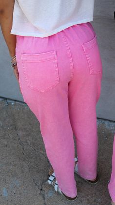 A pair of high-waisted pink denim colored jeans with a slight acid wash. These jeans have a stretchy waistband for a better fit and ultimate comfort. Fit: True to size Extra small: 0-2 Small: 2-4 Medium: 6-8 Large: 10-12 Laundry: wash on cold, hang to dry Model: Angel is in Extra Small, Natalie is in Large Hot Pink Jeans Outfit, Pink Jeans Outfit, Hot Pink Jeans, Queer Style, Queer Fashion, Pink Denim, Skirt Jumpsuit, Pink Jeans, Kids Outerwear