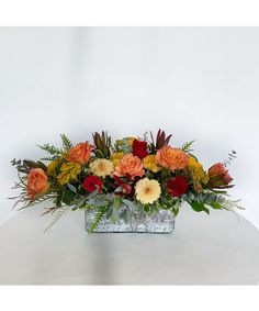 a vase filled with flowers on top of a table