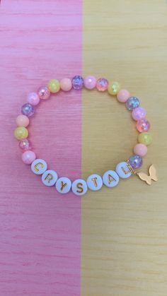 "This is a simple but perfect bracelet for any little girls! The personalized name could be the first spelling lesson for your little girl to write her own name! All orders come with 1 personalized bracelet and a 24K Gold Butterfly charm. 💝Add an extra charm or 2 to any of your bracelets for a low price of $1 each 👉🏻 https://etsy.me/36LE9om 🎁This is the perfect birthday gift for your daughter, grand-daughter, nieces, god-daughter! We offer gift wrapping option with a nice jewelry box and mak Cute Personalized Yellow Bracelets, Personalized Yellow Stretch Bracelet As Gift, Pink Beaded Bracelet With Name, Pink Name Bracelet With Round Beads For Personalized Gift, Pink Letter Beads Stretch Bracelet For Birthday, Pink Stretch Bracelet With Letter Beads For Birthday, Personalized Yellow Beaded Bracelets For Gifts, Personalized Yellow Beaded Bracelets As Gift, Personalized Yellow Beaded Bracelet Gift