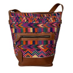 Intertwined's huipil bucket bag is sustainably made from a second-hand huipil, a traditional handwoven blouse worn by Mayan women in Guatemala. Cuero Malec, a Guatemalan leather shop, recycles these huipiles by transforming them into gorgeous, durable, handcrafted artisanal bags. A one-of-a-kind blend of traditional style and modern sustainability! It's an eco-friendly fashion statement for all occasions. Woven Leather Bucket Bag For Market, Bohemian Handwoven Bucket Hobo Bag, Bohemian Shoulder Bag With Woven Leather, Everyday Multicolor Shoulder Bag With Weaving Work, Bohemian Woven Leather Bucket Tote Bag, Handwoven Shoulder Bag For Market, Artisan Bags With Weaving Work, Artisan Handwoven Bucket Bag For Everyday, Bohemian Shoulder Bucket Bag For Market