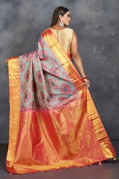 Look elegant at parties and festive occasions in this beautiful grey floral Kanjeevaram saree with pink zari border and pallu. It comes with a matching blouse piece. Shop silk sarees in USA from Pure Elegance. Disclaimer: The shown stitched blouse on the model is for display purpose only. The saree comes with a matching blouse piece and finished with fall and piko. Silk Sarees Kanchipuram, Tussar Silk Sarees, Kanjivaram Saree, Latest Designer Sarees, Pure Elegance, Fashion Journals, Kanjivaram Sarees, Tussar Silk Saree, Indian Saree