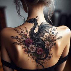 a woman with a dragon tattoo on her back