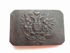 an old metal object with ornate designs on it