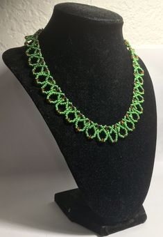 A handmade glass beaded necklace that is perfect for any occasion: parties, holidays, birthdays, anniversaries. All products are hand-crafted by my mother. Dimensions: - Actual Length: 21.0 cm - Collar Length: 13.0 cm - Width: 13.0 cm - Height: 2.0 cm Lightweight, high quality with a beaded hook as a clasp. Will respond to concerns and suggestions promptly. Shipping costs: Free Domestic Shipping. All orders are sent by air-mail with tracking number. Time of delivery: Estimated 1-3 days for domes Green Round Beaded Necklaces For Party, Spacer Beads Jewelry For Gift Making, Handmade Beaded Necklaces With Round Beads For Celebration, Artisan Beaded Necklaces With Spacer Beads As Gift, Handmade Beaded Bracelets With Round Beads For Celebration, Unique Beaded Necklaces With Spacer Beads For Gift, Adjustable Beaded Necklaces With Bead Caps, Handmade Oval Beads For Jewelry Making, Green Polished Beaded Necklace For Gift