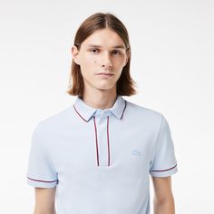 The Smart Paris polo shirt is a particularly elegant take on a Lacoste essential. Made from supple, breathable stretch piqué, with expert design details including a concealed button placket, ribbed trim and a tonal crocodile. A chic, timeless style. Fitted Polo Shirt With Ribbed Collar For Golf, Classic Spring Polo Shirt For Golf, Fitted Golf Tops With Ribbed Collar, Fitted Tops With Ribbed Collar For Golf, Modern Fitted Polo Shirt For Business Casual, Modern Polo Shirt For Work, Formal Summer Polo Shirt With Polo Collar, Summer Formal Polo Shirt With Polo Collar, Formal Summer Polo Shirt With Collar