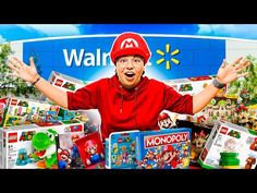 a man in a red hat is surrounded by many nintendo games and video game merchandise