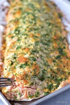 a close up of food in a pan with a fork