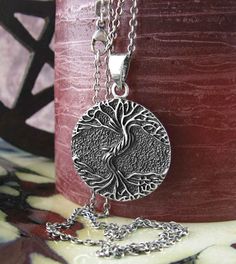 Material: 100% sterling silver Weight: 6.4 grams Size: 1 inch diameter (26mm) Item number: wh285 This 'As Above So Below' Tree pendant illustrates a verse from the Emerald Tablet, a cryptic Hermetic text from almost 1200 years ago: "That which is above is like to that which is below, and that which is below is like to that which is above." The tree's branches mirror its roots, and the tree, with an aged twisting trunk, is raised in relief against a background that has a pebbled texture and is da Sterling Silver Etched Jewelry As Gift, Etched Sterling Silver Jewelry As Gift, Sterling Silver Etched Jewelry For Gifts, Spiritual Sterling Silver Etched Necklaces, Spiritual Etched Sterling Silver Necklace, Silver Etched Pendant Jewelry, Spiritual Etched Sterling Silver Necklaces, Etched Sterling Silver Round Necklace, Etched Silver Pendant Jewelry