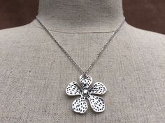 "Big, bold and unique silver flower pendant necklace. simple, refined and eye catching. It has incredible detail and design. The perfect everyday necklace for any nature lover. The pendant measures 1 3/8\" long by 1 3/8\" wide and made from allergy free plated silver. It hangs from a simple shiny 18\" stainless steel necklace chain with a lobster clasp. I have matching earrings in my shop if you would like the whole set. Here is a direct link https://etsy.me/37xz8Ql Thanks for stopping by! Pleas Metal Flower Charm Necklaces, Silver Necklaces With Flower Charm For Spring, Silver Necklace With Flower Charm For Spring, Spring Flower-shaped Metal Necklaces, Spring Flower-shaped Metal Necklace, Silver Flower Shaped Metal Necklace, Nickel Free Flower Shaped Necklace, Silver Flower-shaped Metal Necklace, Silver Necklaces For Spring Gift