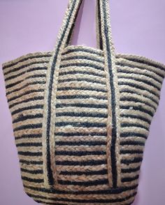 These bags are eco-friendly and made from 100% natural jute. These bags are made for your long walks to ensure your travel comfort and give you elegant beach style. It adds casual charm to your daily personality. The straps are made fine and strong so you can easily carry it on your shoulder and keep your hands free. Hence a very convenient type of bag. Item: handmade braided Size: 30 x 30 x 30 cm Type: shoulder bag/ cross for bag Material: jute and cotton Production area: Panipat India Delivery Luxury Jute Crochet Bag For Shopping, Fair Trade Jute Crochet Bag For Daily Use, Eco-friendly Handmade Jute Bag, Fair Trade Beige Jute Bag, Casual Fair Trade Jute Bags, Fair Trade Jute Beach Bag, Fair Trade Jute Beach Bag For Daily Use, Bohemian Burlap Bag In Natural Color, Natural Burlap Handwoven Bag