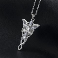 INCLUDES: (1) Lord of the Rings Arwen Evenstar Pendant Necklace SPECIFICATIONS: Metal: Eco-friendly, Nickel-free, lead-free, hypoallergenic Zinc alloy DIMENSIONS: Chain: 19.68 in (50cm) Length Pendant Width: 0.87 in (2.9cm) Pendant Height: 1.58 in (5.3cm) DESCRIPTION: Embrace the timeless elegance of Elven grace with this Lord of the Rings Arwen Evenstar Pendant Necklace. Inspired by Arwen's radiant Evenstar pendant in the iconic fantasy saga, this necklace is a tribute to love, courage, and the Elven Jewelry Necklaces, Lotr Collection, Arwen Necklace, Lord Of The Rings Necklace, Evenstar Necklace, Castles Crumbling, Arwen Evenstar, Elf Princess, Twilight Stars