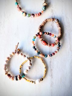 "Beautiful mix of the southwestern color..marigold, rust, gold, pumpkin, browns, blue, sienna, touches of purple, green, and mustard. Lots of neutrals and tons of texture. Recycled sugar glass, African bone beads, unique Yellow Opal, pearls, coconut disks, rustic wood, several Jasper and Agate varieties, Jade, shells, and more. Blended in with natural shell, fused glass, and bone beads. The item/s pictured is the item you will receive. Bracelets are 7.0\" to 7.5\" in length. Please let me know if you need a modification. This may delay the shipping slightly but I do not charge for alterations in size.  More or less beads will slightly change the look of the item. HavSolStudio on ETSY | Mixed media . Earthy elegance . Great texture . Beach inspired . Coastal calm . A little rustic . Worldly Adjustable Bohemian Stretch Bracelet With Wooden Beads, Bohemian Turquoise Beaded Bracelets For Everyday, Handmade Adjustable Bohemian Stretch Bracelet, Bohemian Assorted Jewelry For Festivals, Everyday Bohemian Turquoise Beaded Bracelets, Bohemian Stretch Bracelet With Round Beads, Assorted Bohemian Jewelry For Festivals, Bohemian Festival Jewelry In Assorted Colors, Artisan Multicolor Beaded Bracelets With Natural Stones