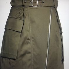 Army Green Belted Skirt With Large Pockets On Each Side. Belt Has Silver Buckle,Skirt Has Long Zipper Down Front Of Skirt Fall Workwear Skirt With Zip Fly, Fitted Knee-length Cargo Skirt With Lining, Workwear Mini Skirt With Side Zipper, Spring Workwear Skirt With Side Zipper, Workwear Mini Skirt With Zip Fly, Asymmetrical Skirt With Side Zipper For Spring, Fitted High Waist Skirt With Zip Fly, Zip Fly Skirt For Spring Workwear, Spring Workwear Skirt With Zip Fly