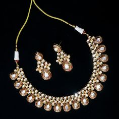 Exotic and snag-free kundan beaded necklace set with earrings. This is a stylish set with White Kundan. This set will work well with traditional, formal, and western formals. Eye-catching and unique jewelry that will set you apart. Gift this piece to a loved one, and see their face light up with joy. Best for gifting or for personal use, wear it to any occasion and become the spotlight. Option 1 : White (D536) Option 2 : Red & Green (D537)