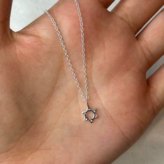 This super cute sterling silver dainty Star of David charm necklace is beautiful in its simplicity. A perfect size to wear every day on its own or layered with other simple chains. The Star of David necklace is a timeless piece of jewellery that symbolises Jewish heritage and faith. 💖 Details 925 Sterling Silver Pendant: 8 mm Length: choose from 40, 42 or 45 cm 💕 Online store: www.thejewellerytree.net 💕 Stay up-to-date with new designs & special offers  - FOLLOW ME   Socials: @myjewellerytree OR  https://www.facebook.com/thejewellerytree1/  💕 Need more info, feel free to email - I'd love to help 💕And please visit my store https://www.etsy.com/au/shop/TheJewelleryTreeCo to see lots more quality sterling silver and gemstone jewellery We care about the environment so when you buy any of Sterling Silver Star Charm Necklace With Clavicle Chain, Silver Star Of David Necklace With Adjustable Chain, Silver Dainty Necklace With Star Charm, Dainty Silver Necklace With Star Charm, Nickel-free Sterling Silver Star Of David Necklace, Silver Star Of David Charm Necklace As Gift, Silver Star Of David Charm Necklace For Gifting, Silver Star Of David Charm Necklace For Gift, Sterling Silver Star Charm Necklace Nickel Free