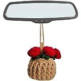 a car mirror with flowers hanging from it's side