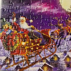 a christmas jigsaw puzzle with santa on his sleigh