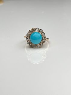 Lovely turquoise target ring with a central turquoise cabochon surrounded by old mine cut diamonds set in rose gold. Size: 6.75 Weight: 3.1 grams Measurement: width of the halo 15mm, and 8.5mm off the finger visit me on instagram @knoxjewels or www.knoxjewels.com to read reviews Halo Diamond Ring, Halo Rings, Diamond Bands, Halo Diamond, Rings Statement, Halo, Statement Rings, Diamond Cuts, Favorite Jewelry