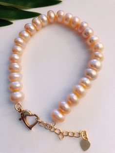 High quality nice cute 8mm-9mm pink flat freshwater pearl with 18k gold plated sweet heart clasp good luster bracelet Good for lady and girl wedding /Valentine's day/ new year/ Christmas/ Mother's Day/ the sweet day you think should memory with your loved one/ daily work, relaxing day,  friend hang out /any sweet happy moment you could wearing with it!  Each of my products I picked materials careful by myself with heart!  This bracelet made by myself with warm heart if you have any questions or problems welcome contact me or return it ! I am very new in Etsy !Thank you for visiting my shop wish you have a wonderful day ! hope you come back visiting 🥰 Friends Hanging Out, Lucky Bracelet, Pink Flats, Valentine Wedding, Sweetest Day, Sweet Heart, Elastic Bracelet, Relaxing Day, Happy Moments