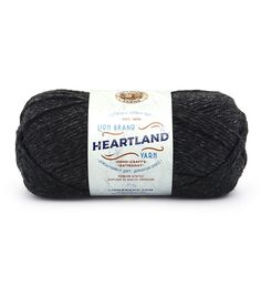 a skein of wool yarn with the words heartland written in white on it