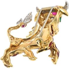 Explore the dimensions of design, where meticulous craftsmanship meets modern luxury in the exquisite David Webb Platinum & 18K Yellow Gold Red Enamel Bull Brooch. This timeless piece is a testament to elegance and sophistication, featuring cabochon and pear-cut rubies totaling approximately 3.0 carats that infuse a rich, vibrant allure into the brooch. Complementing this are pear-cut emeralds weighing around 0.25 carats, adding a delightful pop of color and a touch of refined elegance.The brilliance of this brooch is further enhanced by brilliant-cut and 8x8-cut diamonds, totaling approximately 1.20 carats, which create a mesmerizing sparkle, catching the light with every movement. Its dimensions, approximately 6.0 x 5.7 cm, make it a statement piece that commands attention and elevates a Luxury Yellow Gold Cabochon Brooches, Luxury Cabochon Brooches For Anniversary, Luxury Anniversary Brooches With Cabochon, Luxury Gold Brooches With Cabochon, Luxury Yellow Gold Gemstone Brooch, Luxury Yellow Gold Brooches With Gemstones, Luxury Yellow Gold Gemstone Brooches, Collectible Gold Brooches With Gemstones, Luxury Jeweled Brooches