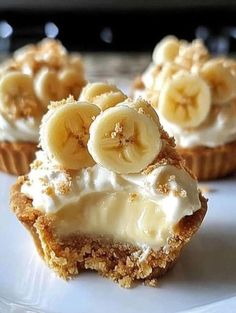 some bananas are sitting on top of cupcakes