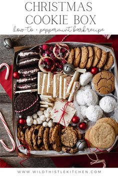 a box filled with cookies and candy canes on top of a red table cloth