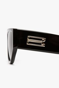 Introducing the B Frame Logo Sunglasses, a blend of bold design and modern elegance. Crafted in Italy from high quality acetate, they feature an oversized frame that is both striking and feminine. The sleek black lenses add a touch of sophistication, while the iconic B emblem on the temple adds a signature detail. These sunglasses are a timeless piece for any wardrobe. Victoria Beckham B Frame Logo Sunglasses In Black  - Size ONE SIZE UK Luxury Polarized Sunglasses In Triacetate, Square Frame Tinted Sunglasses For Office, Luxury Acetate Cat Eye Sunglasses With Polarized Lenses, Luxury Cat Eye Sunglasses With Polarized Lenses, Evening Acetate Sunglasses With Mirrored Lenses, Chic Acetate Sunglasses For Formal Occasions, Chic Formal Acetate Sunglasses, Luxury Acetate Cat Eye Sunglasses, Chic Polarized Sunglasses In Triacetate