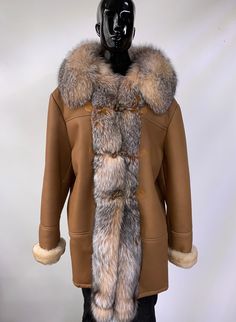 The Brandon shearling coat is crafted from nappa leather, lined with shearling, and trimmed with 100% genuine fox fur.Nappa leather provides a higher degree of luxury and is a higher grade of leather than standard leather.Customize this coat in any color. Due to it's customizable nature, this fur can take up to 3 weeks to ship. Luxury Fur Coat With Faux Fur Trim For Fall, Mink Colored Leather Fur Coat For Fall, Classic Sheepskin Fur Coat With Faux Fur Lining, Classic Faux Fur Coat With Fur Trim, Luxury Sheepskin Fur Coat For Fall, Luxury Fall Fur Coat With Faux Fur Trim, Mink Leather Fur Coat For Fall, Luxury Long Coat With Faux Fur Lining, Classic Leather Fur Coat With Faux Fur Lining