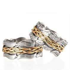 two gold and silver rings with braiding on the sides, set against a white background