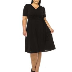 Product Description: Step into elegance with the Plus Size Stylish Solid Faux Wrap Dress featuring a Deep V-Neck. This chic and sophisticated dress is designed to flatter your curves while providing ultimate comfort. The faux wrap design creates a beautiful silhouette, and the deep V-neck adds a touch of allure. Crafted from high-quality, stretchable fabric, this dress is perfect for any occasion, from casual outings to formal events. Available in a range of solid colors, it's a versatile additi Black V-neck Surplice Neckline Dress For Fall, Black Midi Dress With Surplice Neckline For Fall, Black Short Sleeve V-neck Dress For Work, Moa Collection, Beautiful Silhouette, Sophisticated Dress, Faux Wrap Dress, Plus Size Dress, Deep V Neck