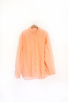 "Minimal pale neon orange natural linen button down shirt. Loose, oversized fit with a chest pocket and comfortable feel. Great condition. 'Tommy Bahama' brand 100% Linen Size XL Measures: 31\" length 25\" across chest 25.5\" sleeve 2\" collar LA-1" Cheap Orange Button-up Blouse, Soft Orange, Button Down, Colour Board, Wrap Blouse, Neon Orange, Natural Linen, Tommy Bahama, Chest Pocket