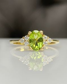 For more gorgeous jewelry, please visit : https://www.etsy.com/shop/MastikaJewelry Peridot & Diamond Dainty Cluster Ring, Classic Engagement Ring in 14K Solid Gold, August Birthstone, Genuine Gemstone, Cocktail, Best Gift ◎ Details ◎ ○ Gemstone Details .Natural PERIDOT Oval Cut approx 7x5 mm approx. 0.80 ct .Conflict Free DIAMOND Round Cut 1.70 mm 6 pcs F/G VS/SI total approx. 0.10 ct ○ Gold Details 14K Solid Gold Weight of Ring : approx 2.00 gr Made to Order HANDMADE ITEM ○ Upgrade to Solid Peridot And Diamond Engagement Rings, Engagement Rings Peridot, Peridot Engagement Ring, Peridot Rings, Classic Gold Ring With Peridot, Formal Peridot Ring With Accent Stones, Formal Yellow Gold Peridot Birthstone Ring, Elegant Yellow Gold Peridot Birthstone Ring, Yellow Gold Peridot Birthstone Ring