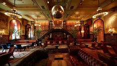 an ornately decorated lobby with couches and chairs