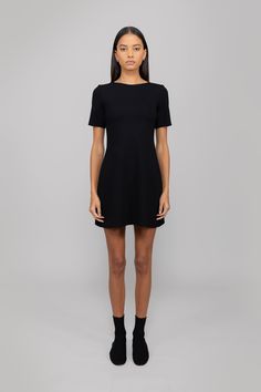 #color_black Knee-length Elastane Mini Dress With Flattering Silhouette, Chic Short Sleeve Mini Dress In Elastane, Chic Short Sleeve Elastane Mini Dress, Sleek Elastane Dress With Straight Neckline, Flattering Black Elastane Mini Dress, Classic Black Stretch Mini Dress, Sleek Elastane Mini Dress, Black Elastane Mini Dress With Flattering Silhouette, A-line Mini Dress With Flattering Silhouette In Elastane