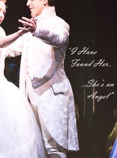 a man and woman dressed in white dancing on stage with the caption above them