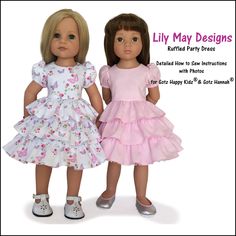 two dolls standing next to each other in front of a sign that says lily may designs