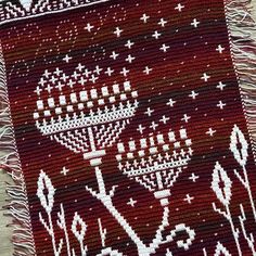 a red and white rug with an image of menorah on it