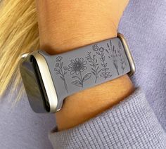 "Silicone replacement watch band compatible with Apple Watch These custom watch bands are laser engraved with beautiful wildflower design on one side and Live, Laugh, Love quotes on the other side. Compatible with Series SE/7/6/5/4/3/2/1 Apple Watch Watch band 38mm 40mm 41mm 42mm 44mm 45mm Available in 17 band colors Sizes available: - 38mm & 40mm & 41mm S/M 5.1\"-7.1\" (130mm-180mm) wrist - 38mm & 40mm & 41mm M/L Fits 5.9\"-7.9\" (150mm-200mm) wrist - 42mm & 44mm & 45mm S/M Fits 5.5\"-7.5\" (14 41mm Apple Watch Band, Granola Apple Watch Band, Apple Watch Band Engraving Ideas, Apple Watch 8 Bands, Laser Engraved Watch Band, Engraved Apple Watch Band, Apple Watch For Women, Watch Bands For Apple Watch, Cute Apple Watch Bands