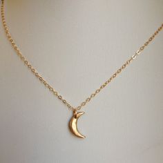 "Another version of our mini moon, this necklace features the tiniest of hand-formed bronze crescent moons. It's so delicate and dainty-a great every day piece. Layer it with larger pieces for a bohemian look. The moon measures approximately 1/2\" long and the 14k gold filled chain is adjustable from 16-18\"." Mini Moon, Crescent Moon Necklace, Bohemian Look, Medallion Necklace, Religious Jewelry, Moon Necklace, Gold Filled Chain, Crescent Moon, Gold Vermeil