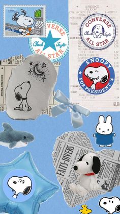 some stickers are laying on top of a blue background with white and black animals