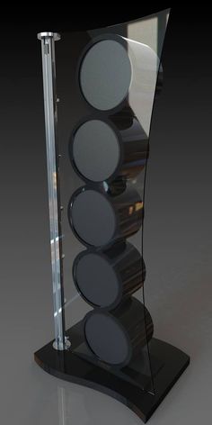 a black and clear display case with speakers on it's sides in front of a dark background