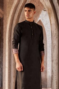 Black full sleeve kurta with paisley print on sleeve hem and mandarin collared neckline. Paired with churidar.
Components: 2
Pattern: Printed
Type Of Work: Paisley
Neckline: Mandarin collar
Sleeve Type: Full sleeves
Fabric: Chanderi, Voile, Lining: Voile
Color: Black
Other Details: 
Front button detailing
Note: Pocket square and bundi worn by the model is not for sale
Occasion: Destination Wedding - Aza Fashions Full Sleeve Kurta, Kurta Set Men, Kurta Set For Men, Churidar, Kurta Set, Full Sleeves, Plain Black, Mandarin Collar, Pocket Square