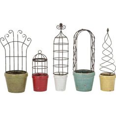 four pots with birdcages in them on a white background