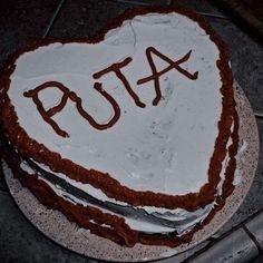 a heart shaped cake with the word ruta written on it