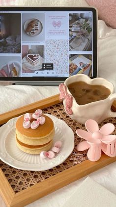 a tray with some food on it next to a laptop